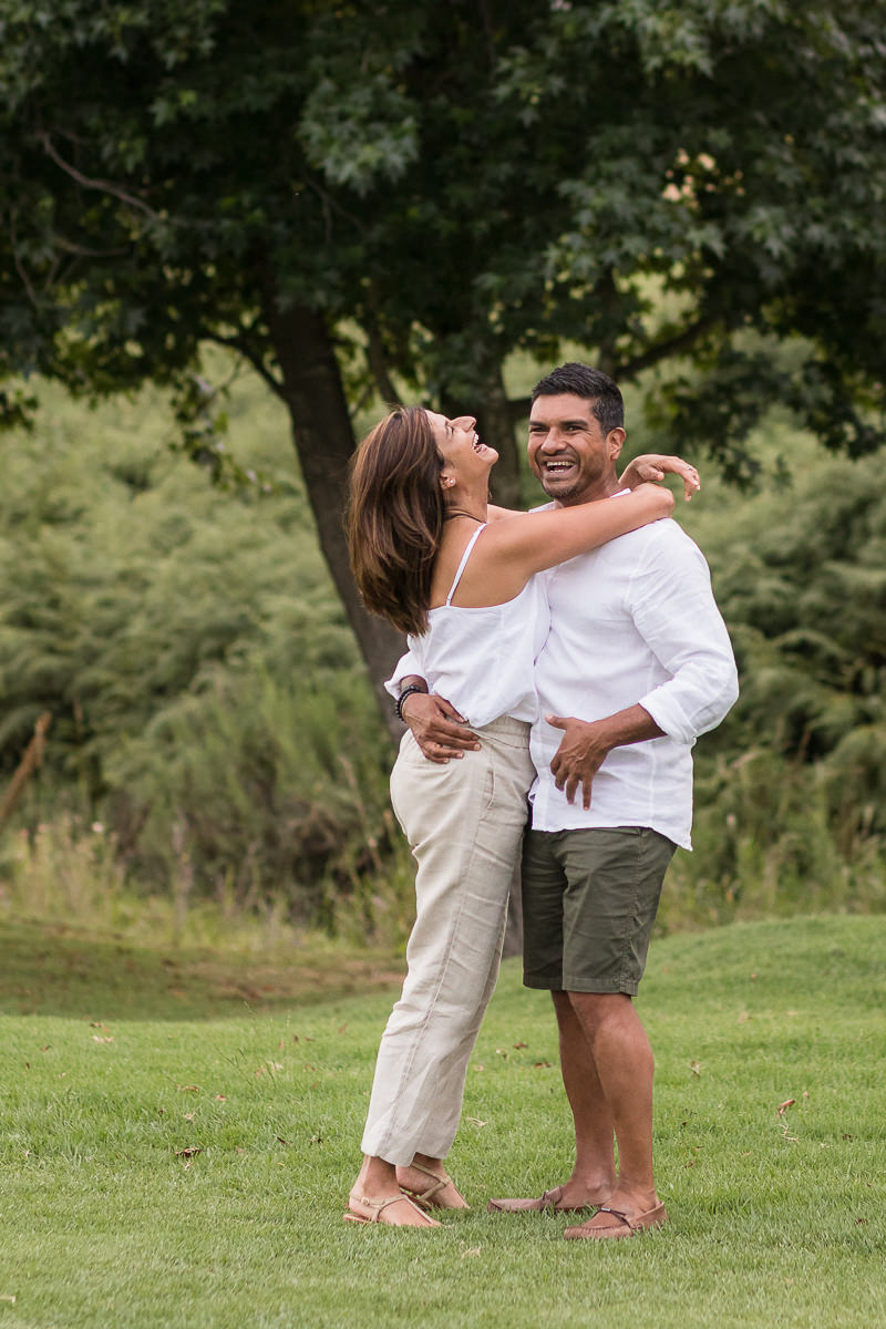 Couple hugging and laughing during Family photo session at Fancourt George
